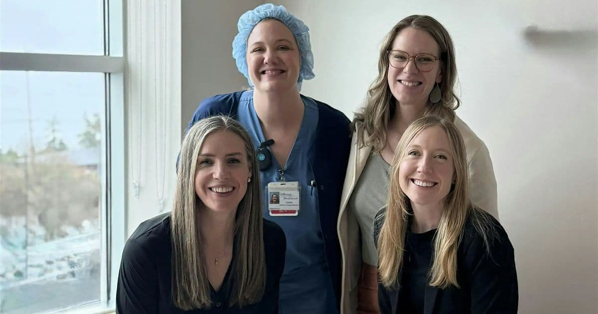 Group photo of smiling nurses and healthcare professionals for the Rural Nursing Leadership Symposium